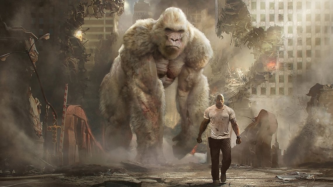 'Rampage - Furia animale'. In alto, una scena di 'Free Guy'