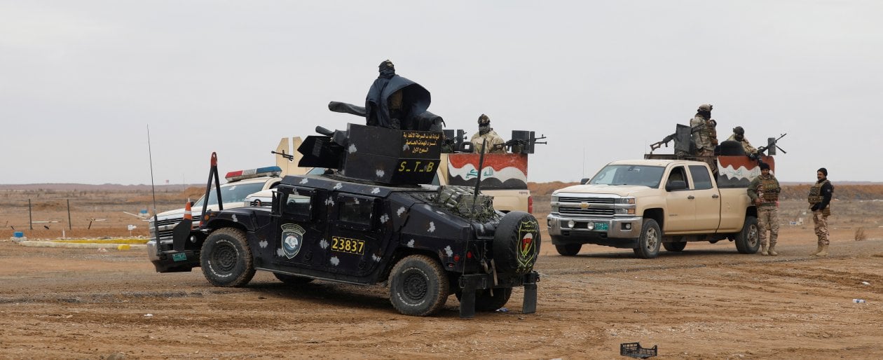 Forze di sicurezza irachene alla frontiera con la Siria