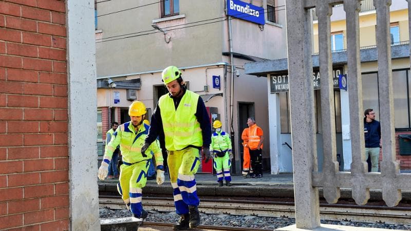 Officials work at the site of a train accident in which workers were killed, in Brandizzo, Italy, August 31, 2023. REUTERS/Massimo Pinca 