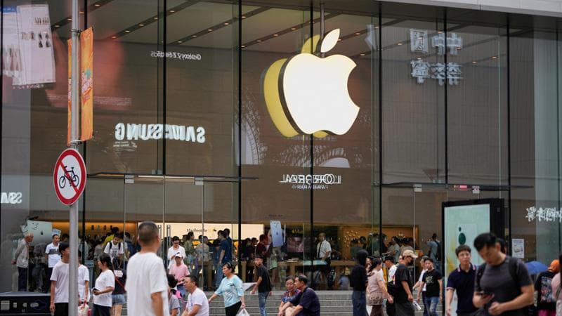 People walk past an Apple store in Shanghai, China September 13, 2023. REUTERS/Aly Song