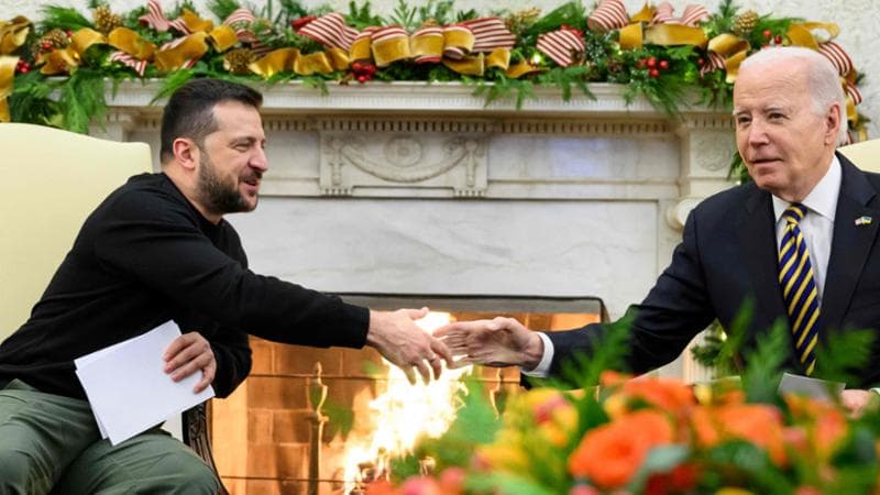 US President Joe Biden shakes hands with Ukrainian President Volodymyr Zelensky as they meet in the Oval Office of the White House in Washington, DC, on December 12, 2023. (Photo by Mandel NGAN / AFP)