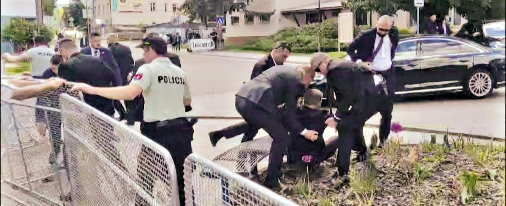 TOPSHOT - This image taken from video footage obtained by AFPTV shows security personnel carrying Slovakia's Prime Minister Robert Fico (C) towards a vehicle after he was shot in Handlova on May 15, 2024. Slovakia's Prime Minister Robert Fico was battling life-threatening wounds after officials said he was shot multiple times in an assassination attempt condemned by European leaders. (Photo by RTVS / AFP)