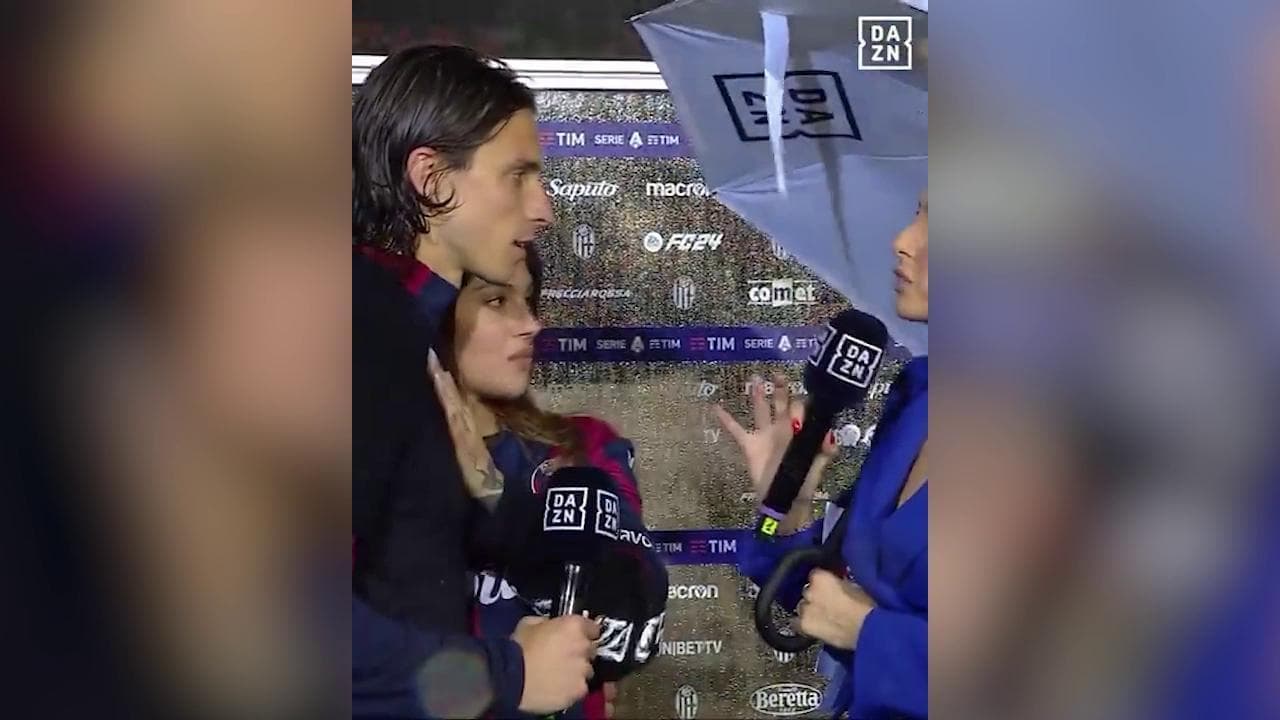Festa Bologna, irruzione nell'intervista della compagna di Calafiori che lo bacia in diretta tv