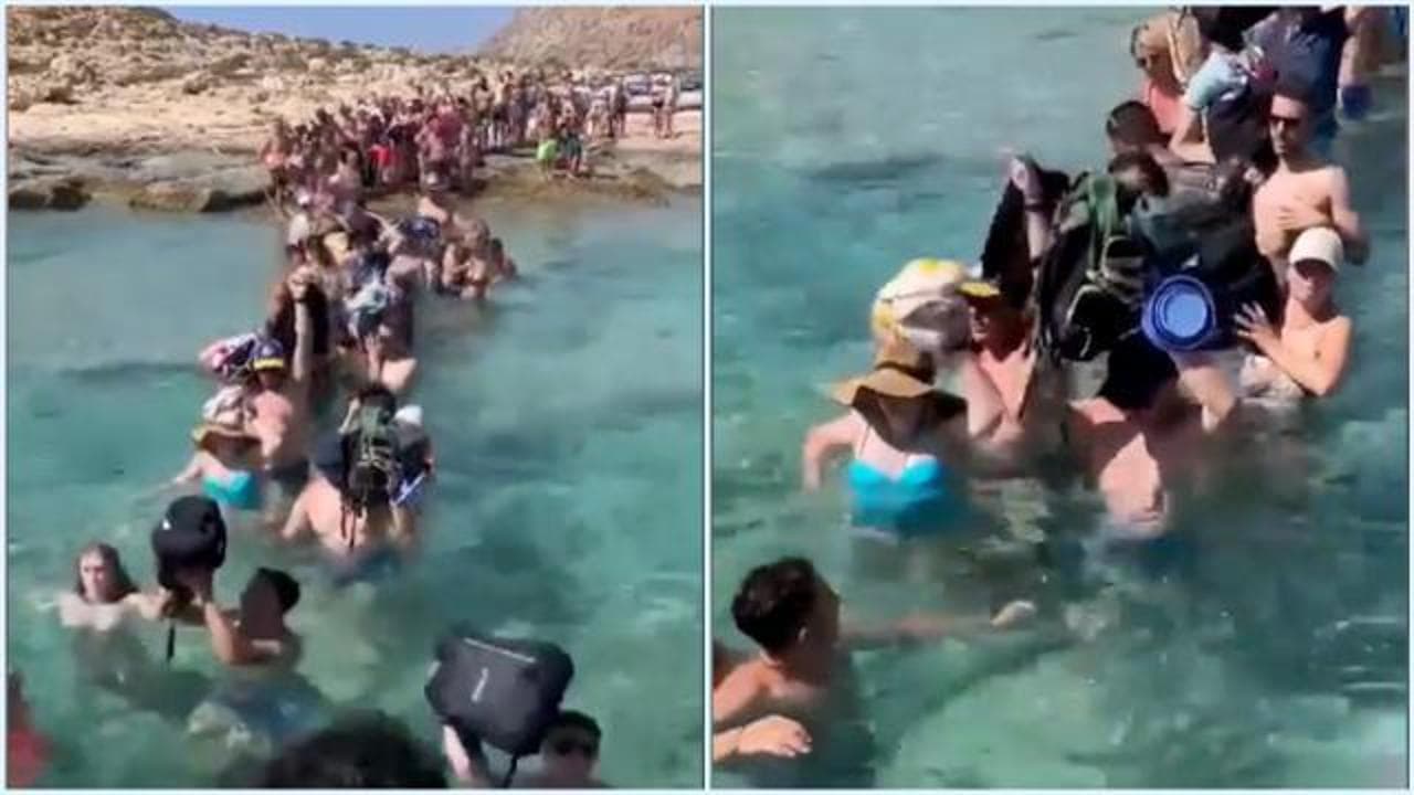 Creta, turisti costretti a sbarcare sulla spiaggia di Balos immersi in acqua e sollevando i bagagli