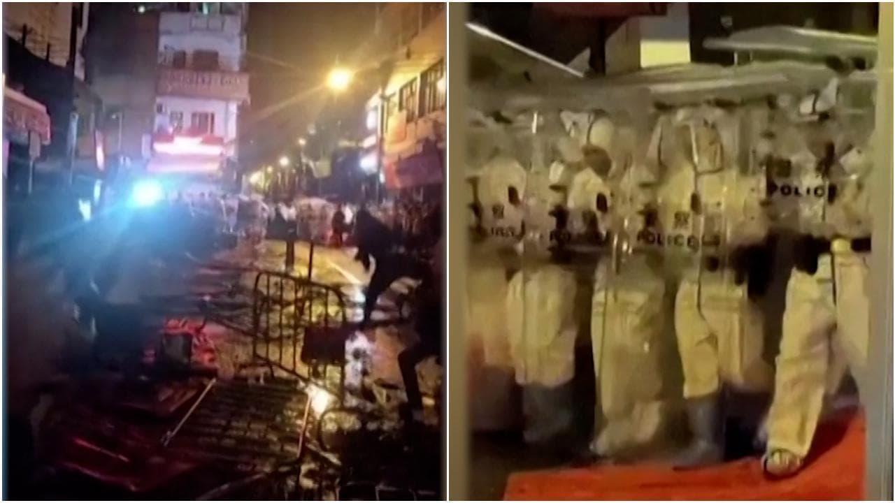 Cina, duri scontri a Guangzhou: la folla lancia oggetti verso la polizia che si ripara con gli scudi