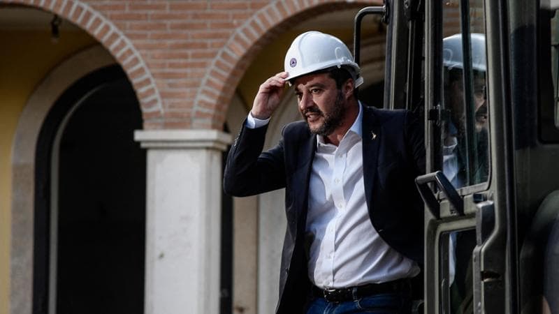 Italy’s Interior Minister and deputy PM Matteo Salvini stands on a bulldozer as he prepares to preside over the demolition of some of eight illegally built villas seized by Rome police to the Casamonica mafia clan in the south-eastern suburb Quadraro district of Rome on November 26, 2018. (Photo by Filippo MONTEFORTE / AFP)