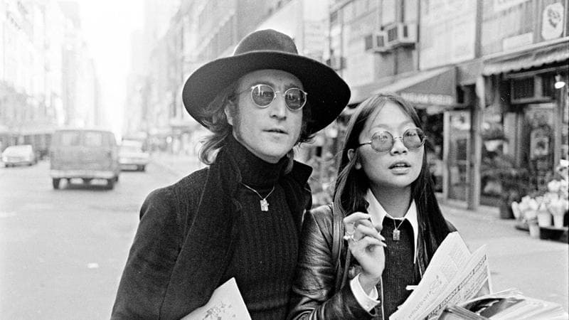 Musician John Lennon and May Pang in New York City on October 17, 1974. (Photo by Peter Simins/WWD/Penske Media via Getty Images)