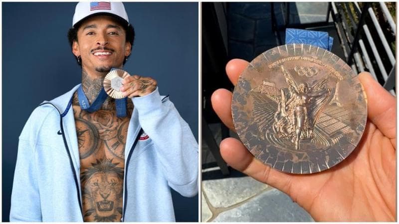 Lo skateboarder Nyjah Huston mostra la sua medaglia di bronzo rovinata
