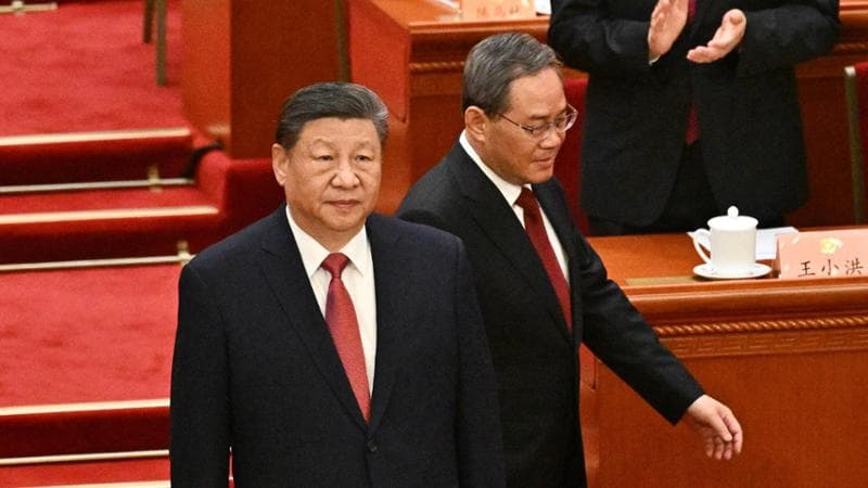China’s President Xi Jinping (L) and Premier Li Qiang arrive for the closing ceremony of the Chinese People's Political Consultative Conference at the Great Hall of the People in Beijing on March 10, 2025. (Photo by Pedro PARDO / AFP)