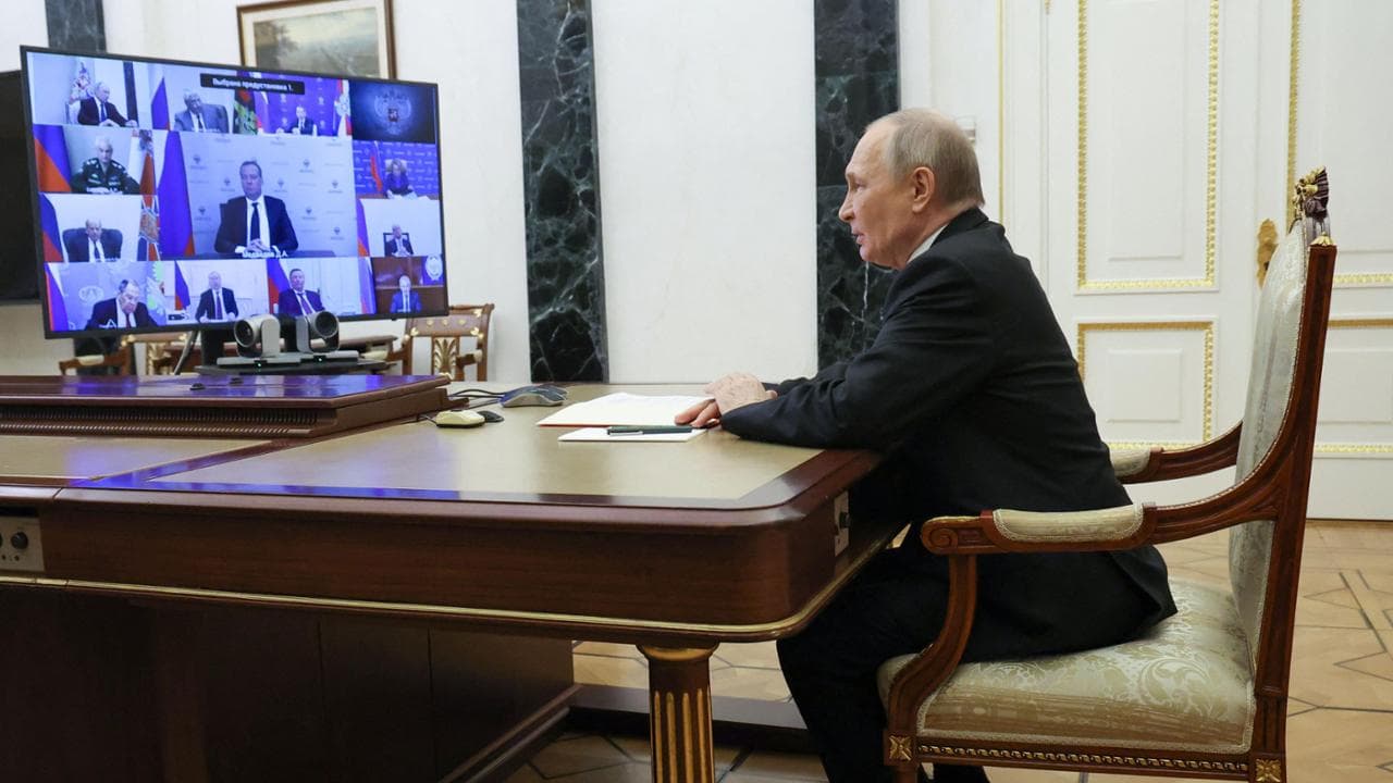 In this pool photograph distributed by the Russian state agency Sputnik, Russia's President Vladimir Putin chairs a Security Council meeting via videoconference at the Kremlin in Moscow on March 28, 2025. (Photo by Vyacheslav PROKOFYEV / POOL / AFP)