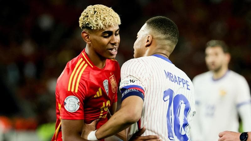 Lamine Yamal and Kylian Mbappé embrace after the match