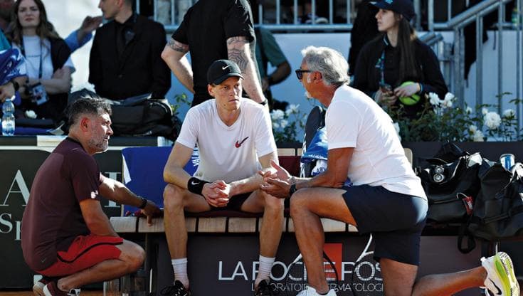 ROME, ITALY - MAY 06:  Jannik Sinner of Italy speaks with fitness coach Marco Panichi (R) and physiotherapist Ulises Badio (L) during a training session on Day Two of the Internazionali BNL D'Italia 2025 at Foro Italico on May 06, 2025 in Rome, Italy. (Photo by Dan Istitene/Getty Images)