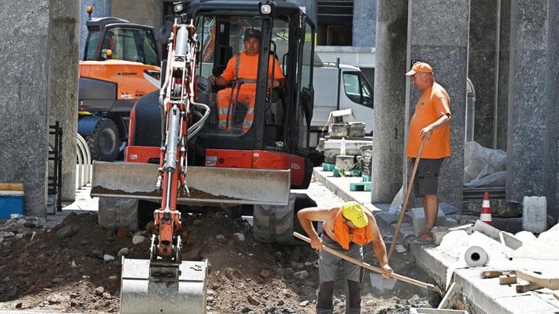 Construction workers working on an infrastructure project in Italy