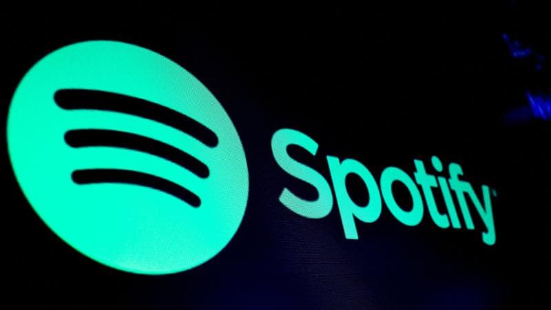 FILE PHOTO: A screen displays the logo of Spotify on the floor at the New York Stock Exchange (NYSE) in New York City, U.S., December 4, 2023. REUTERS/Brendan McDermid/File Photo