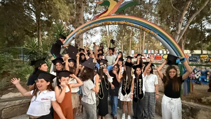 Pupils celebrate the end of classes of the school year at Neve Shalom