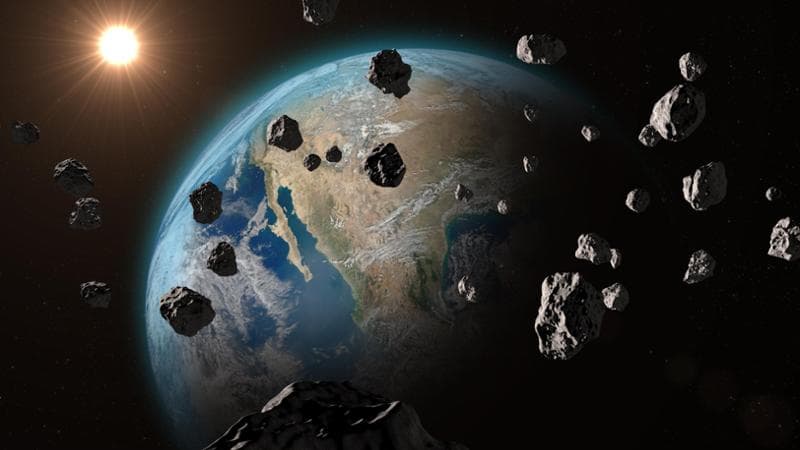 Rendering con meteoriti in arrivo sulla Terra (Shutterstock)