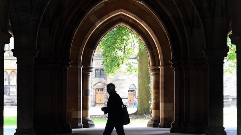 (FILES) A student walks in the campus of Glasgow University complex in Glasgow, Scotland on September 24, 2020. Britain is to rejoin the European Union's Erasmus student exchange programme, which it left almost five years ago following Brexit, a joint UK-EU statement said on December 17, 2025. (Photo by Andy Buchanan / AFP)