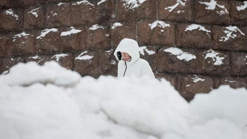 A woman walks (REUTERS/Gleb Garanich)