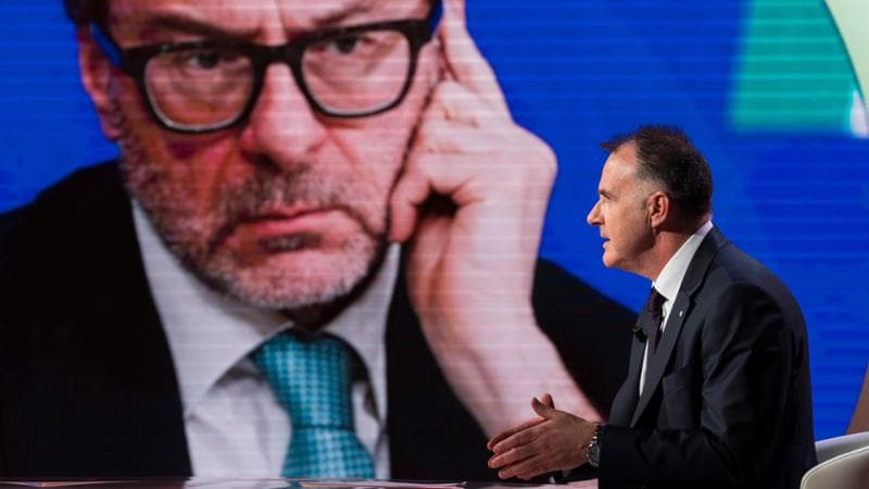 Emanuele Orsini (Confindustria). Sullo sfondo, il ministro Giorgetti