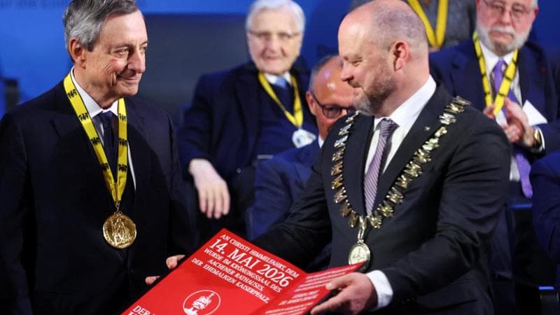 Former President of the European Central Bank and former Prime Minister of Italy, Mario Draghi, receives the International Charlemagne Prize (Karlspreis) 2026 from Mayor of Aachen, Michael Ziemons, during a ceremony in Aachen, Germany, May 14, 2026. REUTERS/Thilo Schmuelgen
