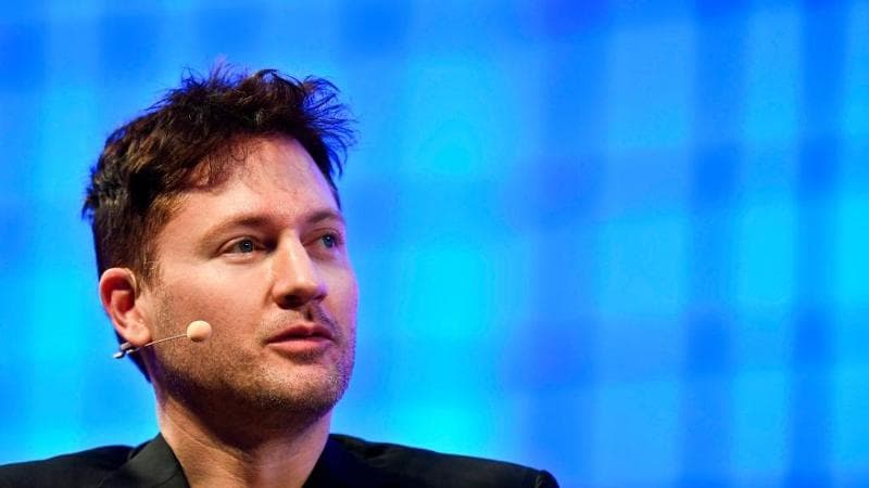 Bryan Johnson gestures during a interview at the main stage of the Web Summit in Lisbon on November 7, 2017