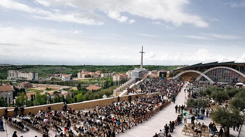 The faithful attend Mass during the public display and veneration of Padre Pio’s body outside the Church of San Pio, designed by Italian architect Renzo Piano, in San Giovanni Rotondo on April 24, 2008.