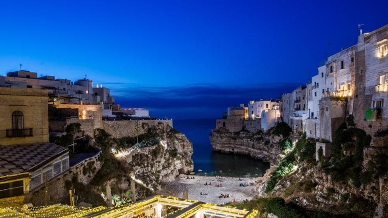 Polignano a Mare and its beach at twilight, Puglia