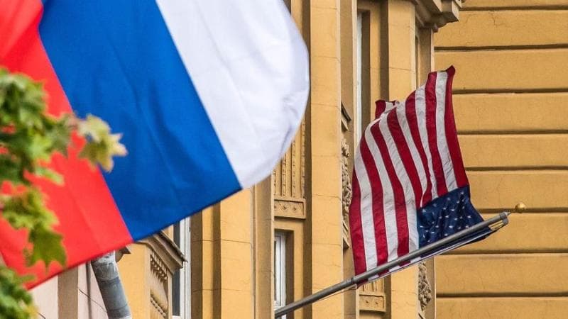 A Russian flag flies next to the US embassy building in Moscow (2017)