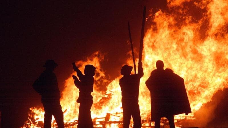 Revellers stand near the fires during Bonfire Night celebrations in Burgess Hill, England. The event is linked to the ancient Celtic festival of Samhain.